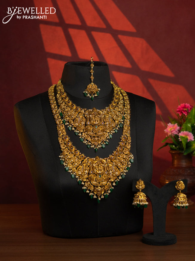 Antique combo set lakshmi design with kemp & cz stones and pearl & green beads hangings