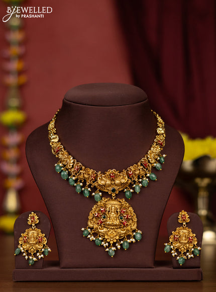 Antique necklace lakshmi design with pavalam & emerald stones and pearl & mint green beads hangings
