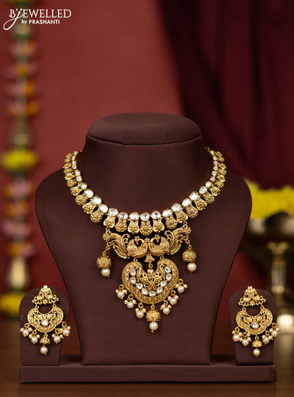 Antique necklace peacock design with kundan stones and pearl hangings