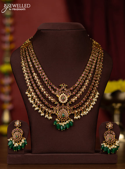 Antiquee multilayer necklace with kemp & stones and pearl & green beads hangings