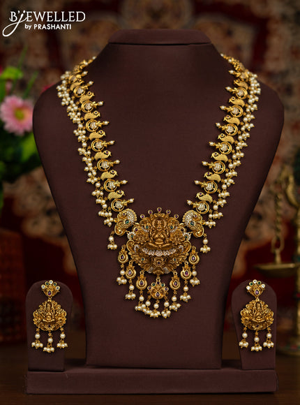 Antique haaram lakshmi & peacock design with kemp & cz stones and pearl & pearl hangings