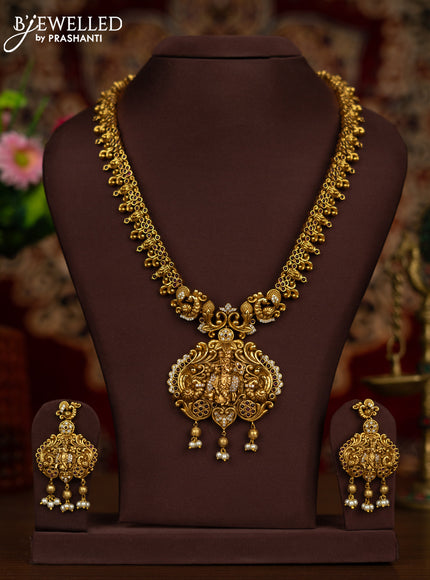 Antique haaram krishna pendant with ruby & cz stones and pearl & golden beads hangings