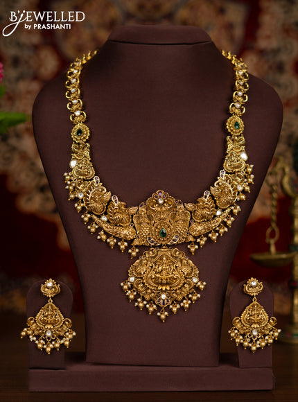 Antique haaram lakshmi pendant with kemp & kundan stones and pearl & golden beads hangings