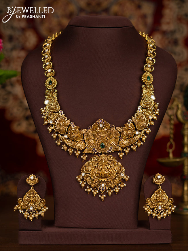 Antique haaram lakshmi pendant with kemp & kundan stones and pearl & golden beads hangings