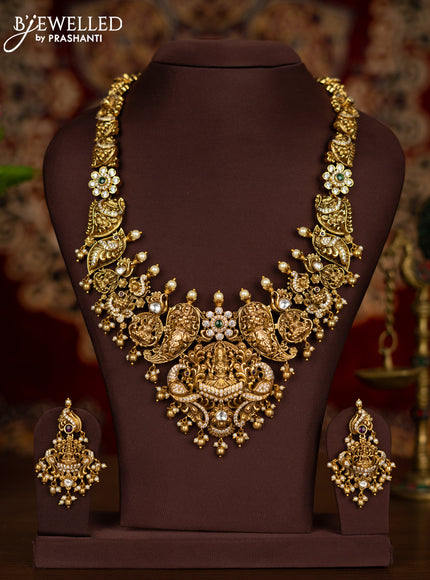 Antique haaram lakshmi pendant with kemp & kundan cz stones and pearl & golden beads hangings