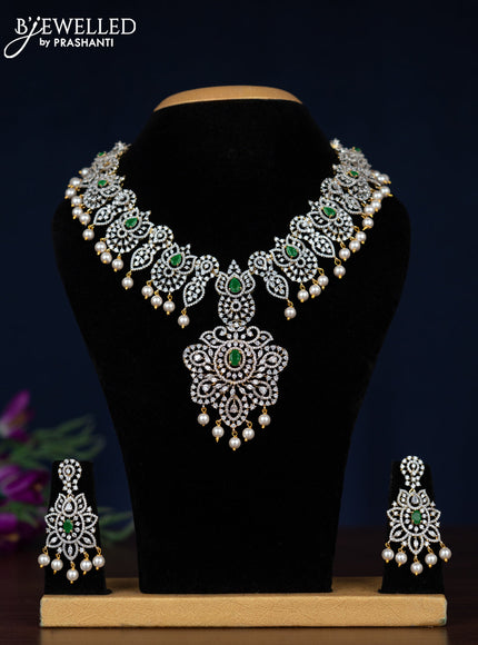 Zircon necklace with emerald and cz stones in gold finish