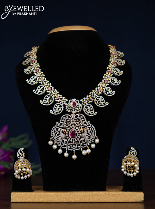 Zircon necklace manga pattern with ruby & cz stones and pearl hangings in gold finish