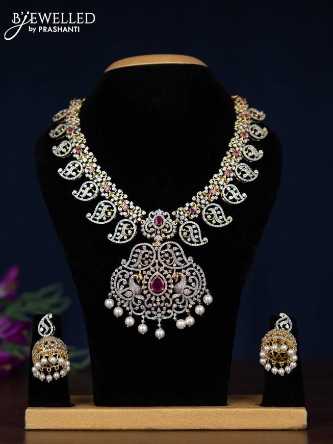 Zircon necklace manga pattern with ruby & cz stones and pearl hangings in gold finish