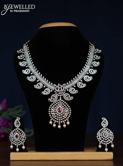 Zircon necklace manga pattern with ruby & cz stones and pearl hangings in gold finish
