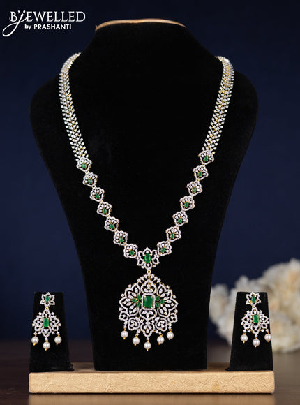 Zircon haaram with emerald & cz stones and pearl hangings in gold finish