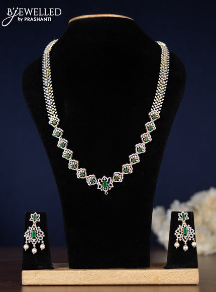 Zircon haaram with emerald & cz stones and pearl hangings in gold finish