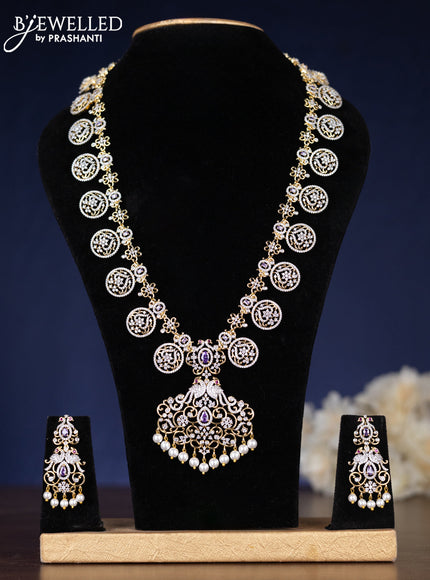 Zircon haaram with purple & cz stones and pearl hangings in gold finish