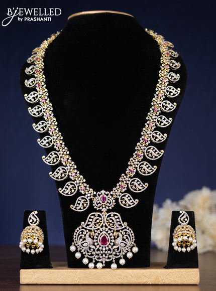 Zircon haaram manga pattern with ruby & cz stones and pearl hangings in gold finish