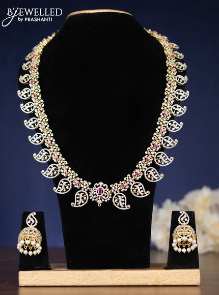 Zircon haaram manga pattern with ruby & cz stones and pearl hangings in gold finish