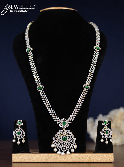 Zircon haaram with emerald & cz stones and pearl hangings in gold finish