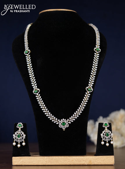 Zircon haaram with emerald & cz stones and pearl hangings in gold finish