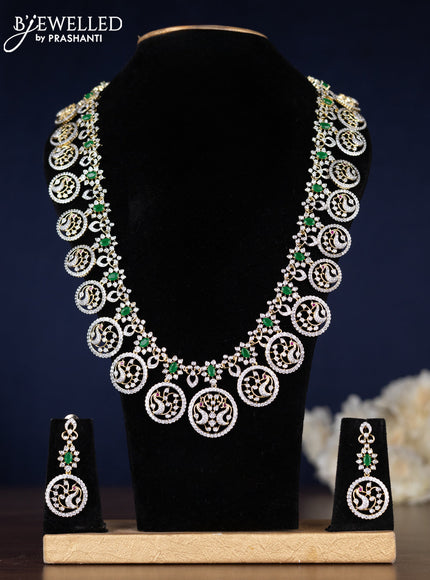 Zircon haaram peacock design with emerald and cz stones in gold finish