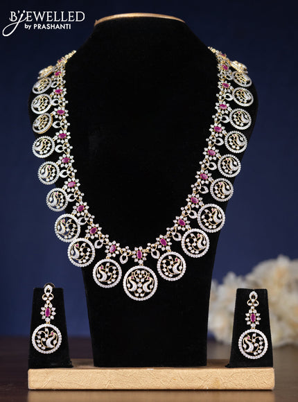 Zircon haaram peacock design with ruby and cz stones in gold finish