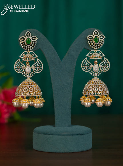 Zircon jhumkas peacock design with emerald & cz stones and pearl hangings in gold finish
