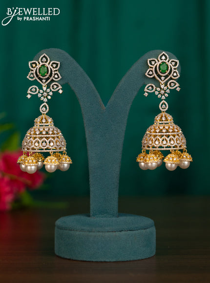 Zircon jhumkas with emerald & cz stones and pearl hangings in gold finish
