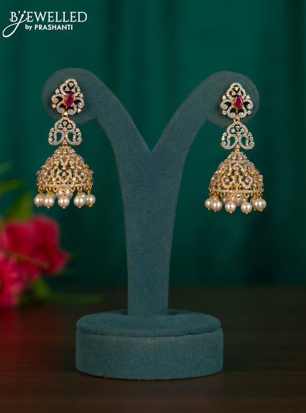 Zircon jhumkas with ruby & cz stones and pearl hangings in gold finish