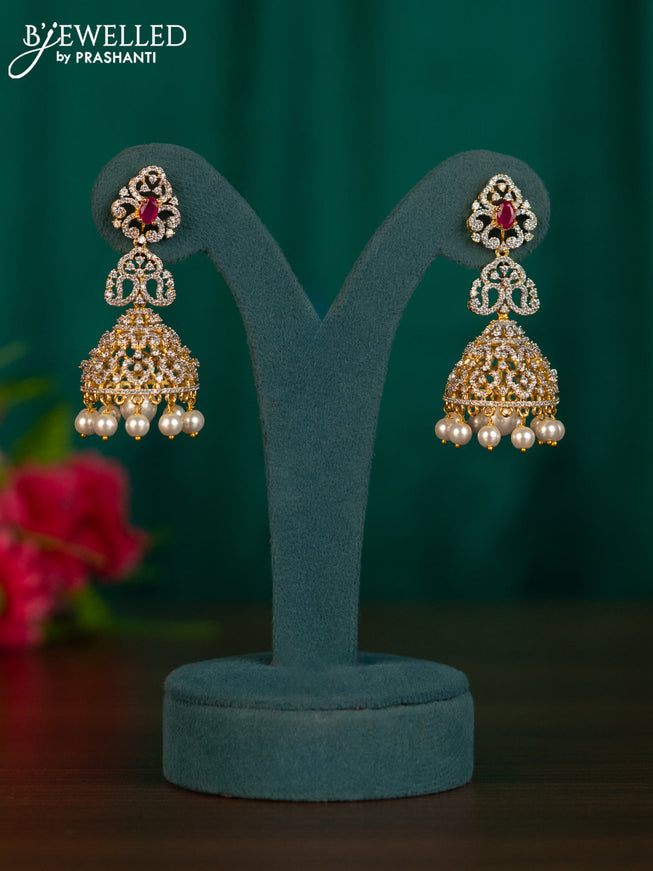 Zircon jhumkas with ruby & cz stones and pearl hangings in gold finish