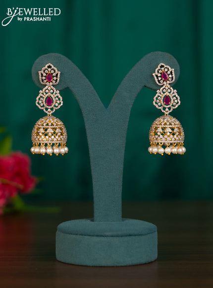 Zircon jhumkas with ruby & cz stones and pearl hangings in gold finish