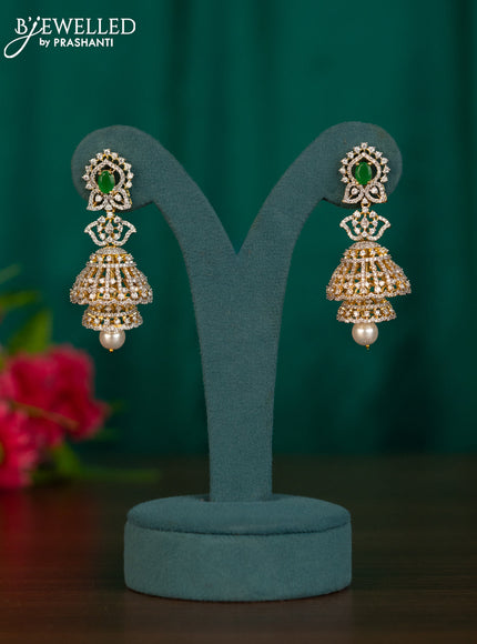 Zircon double layer jhumkas with emerald & cz stones and pearl hanging in gold finish