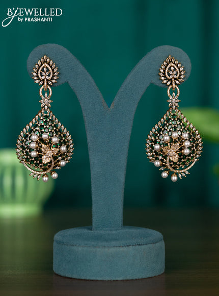 Earrings with emerald & cz stones and pearls in victorian finish
