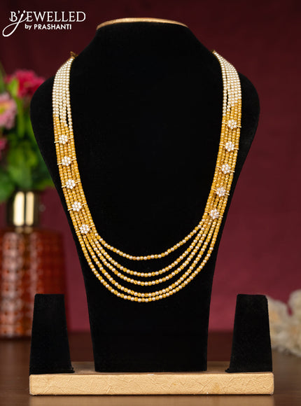 Beaded yellow necklace with cz stones side pendant in gold finish