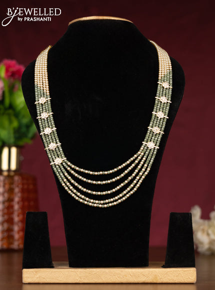 Beaded light green necklace with cz stones side pendant in gold finish