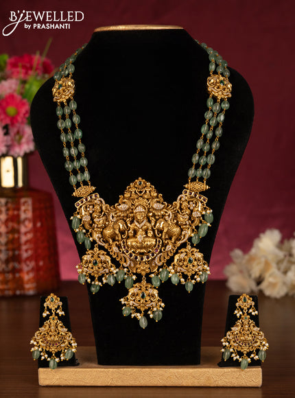 Antique beaded mint green haaram lakshmi pendant with kemp & cz stones and pearl & beads hangings