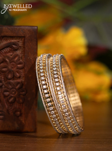 Zircon bangles with cz stones in gold finish