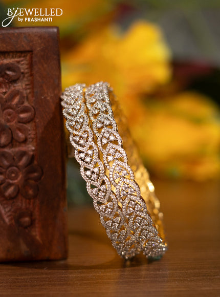 Zircon bangles with cz stones in gold finish