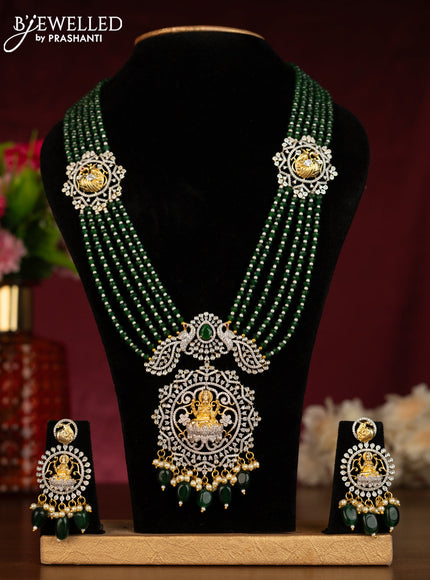 Beaded multilayer green haaram lakshmi & peacock pendant with emerald & cz stones and pearl & green beads hangings