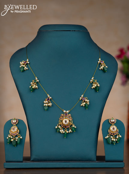 Invisible chain chandbali design with kemp & cz stones and pearl & green beads hangings