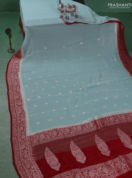 Banarasi chiffon saree light blue and kumkum red with silver zari woven buttas and floral silver zari woven border