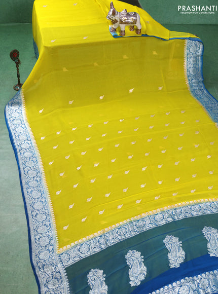 Banarasi chiffon saree lime yellow and cs blue with silver zari woven buttas and floral silver zari woven border