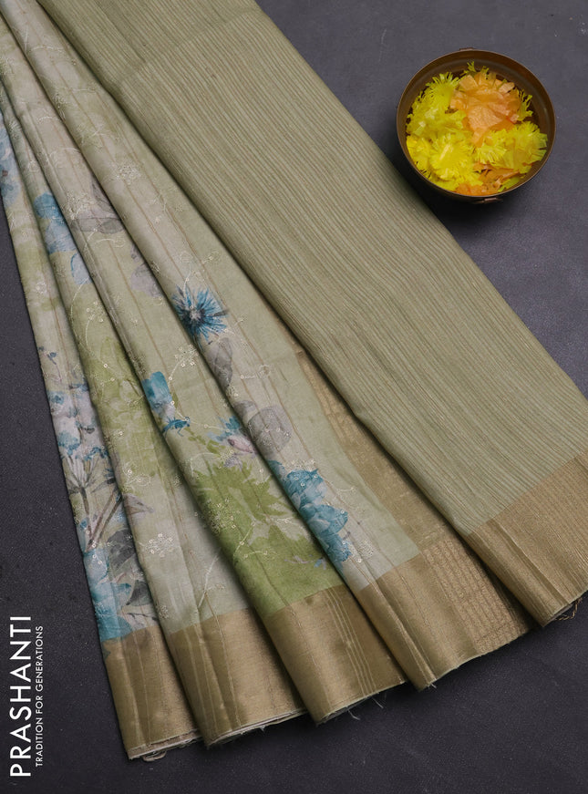 Semi matka saree pista green with allover floral prints & sequence work and zari woven border