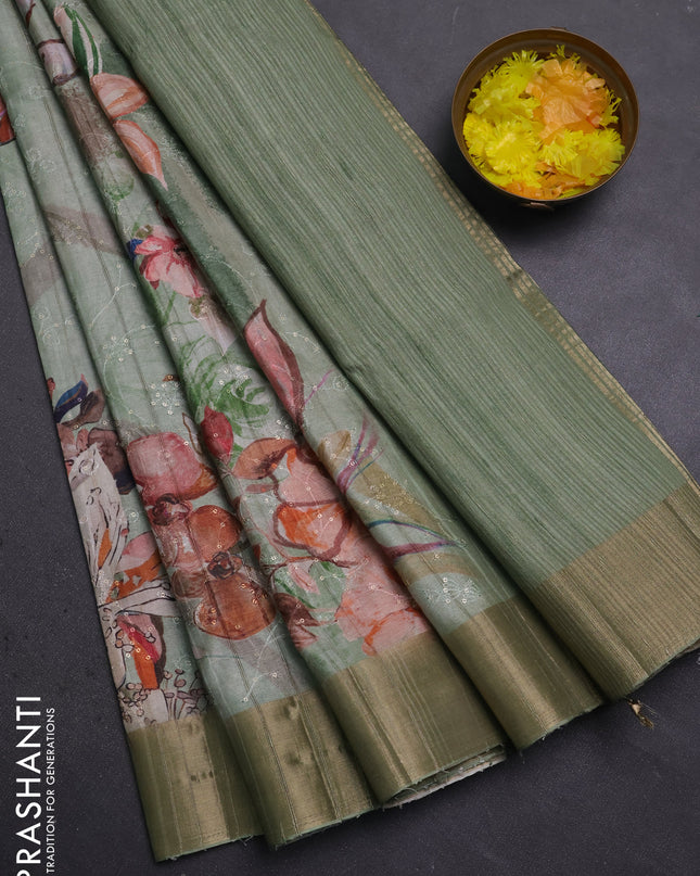 Semi matka saree pastel green with allover floral prints & sequence work and zari woven border
