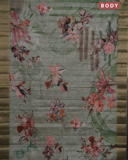 Semi matka saree pastel green with allover floral prints & sequence work and zari woven border