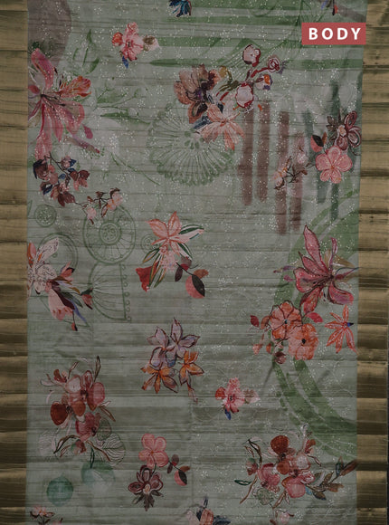 Semi matka saree pastel green with allover floral prints & sequence work and zari woven border