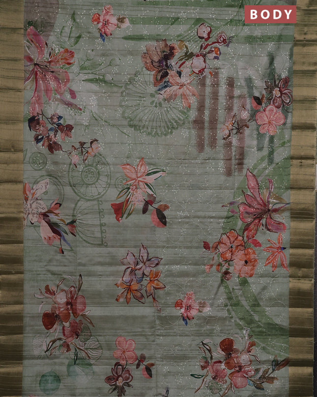 Semi matka saree pastel green with allover floral prints & sequence work and zari woven border