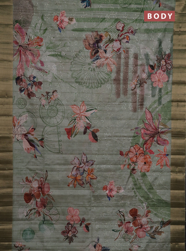 Semi matka saree pastel green with allover floral prints & sequence work and zari woven border