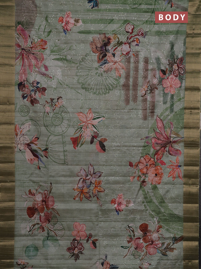 Semi matka saree pastel green with allover floral prints & sequence work and zari woven border