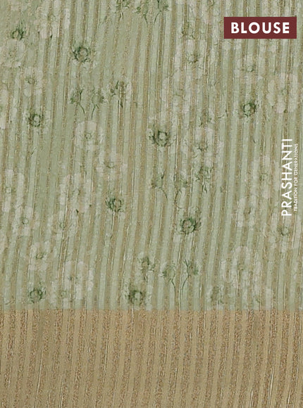 Semi matka saree pista green with allover floral prints & sequence work and zari woven border