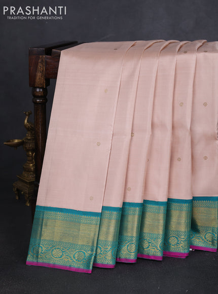 Pure kanchipuram silk saree pastel orange and teal green with zari woven buttas and zari woven korvai border