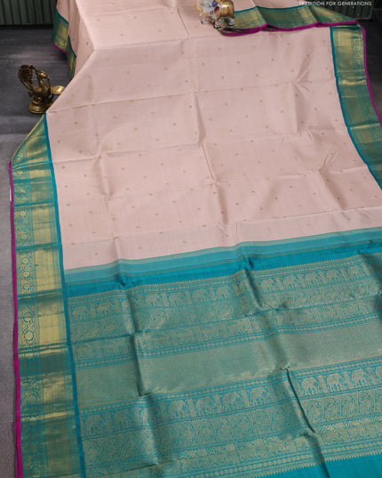 Pure kanchipuram silk saree pastel orange and teal green with zari woven buttas and zari woven korvai border