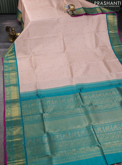 Pure kanchipuram silk saree pastel orange and teal green with zari woven buttas and zari woven korvai border