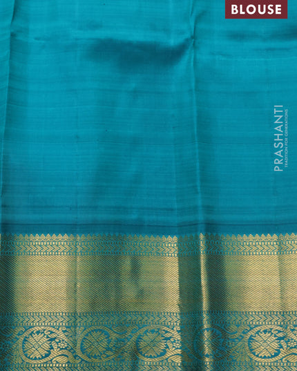 Pure kanchipuram silk saree pastel orange and teal green with zari woven buttas and zari woven korvai border
